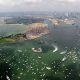 Aerial photograph of Castle Island and Massachusetts Bay with many boats and tall ships