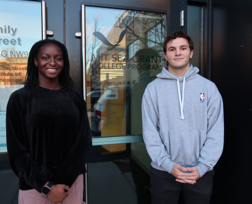 Unyime Usua and Santiago Borrego stand in front of MIT Sea Grant